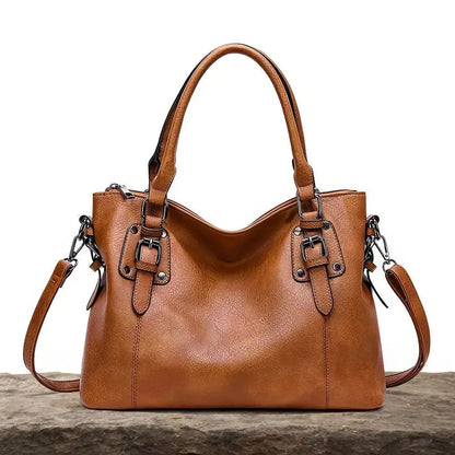 BOLSO CLASICO CON BROCHES DE PIEL CUERO