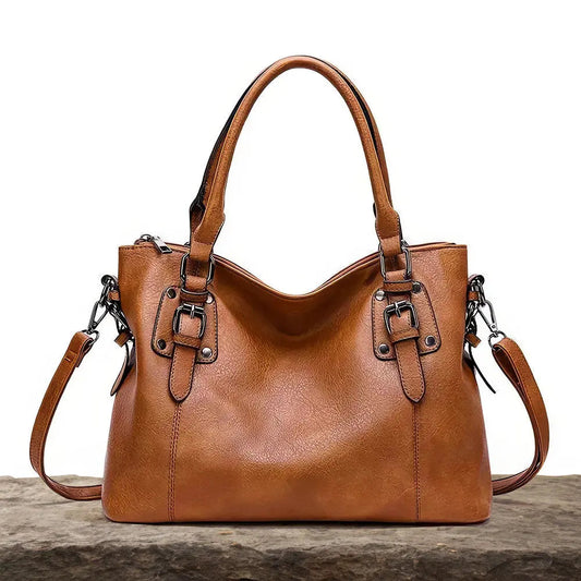BOLSO CLASICO CON BROCHES DE PIEL CUERO