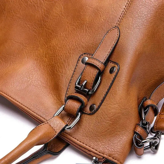 BOLSO CLASICO CON BROCHES DE PIEL CUERO